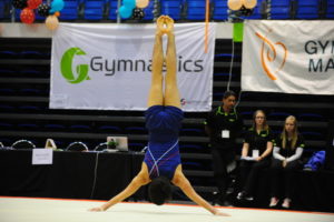 male gymnast in handstand