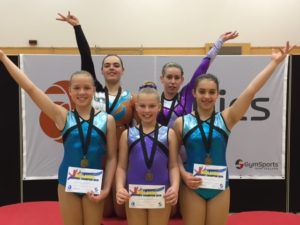 Aerobics Champions with medals and certificates