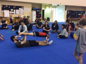 learning gymnastics skills boy in plank partner position