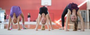 recreational gymnasts doing bridge