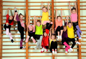 Group of happy kids in the gym