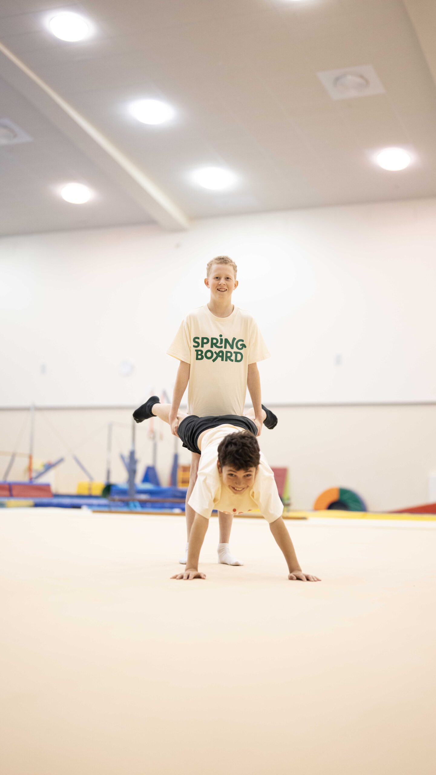 boys doing a wheelbarrow