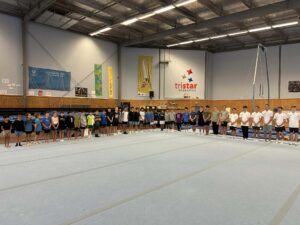 men's gymnast line up for training squad