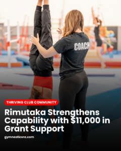 gymnastics coach assisting hand stand